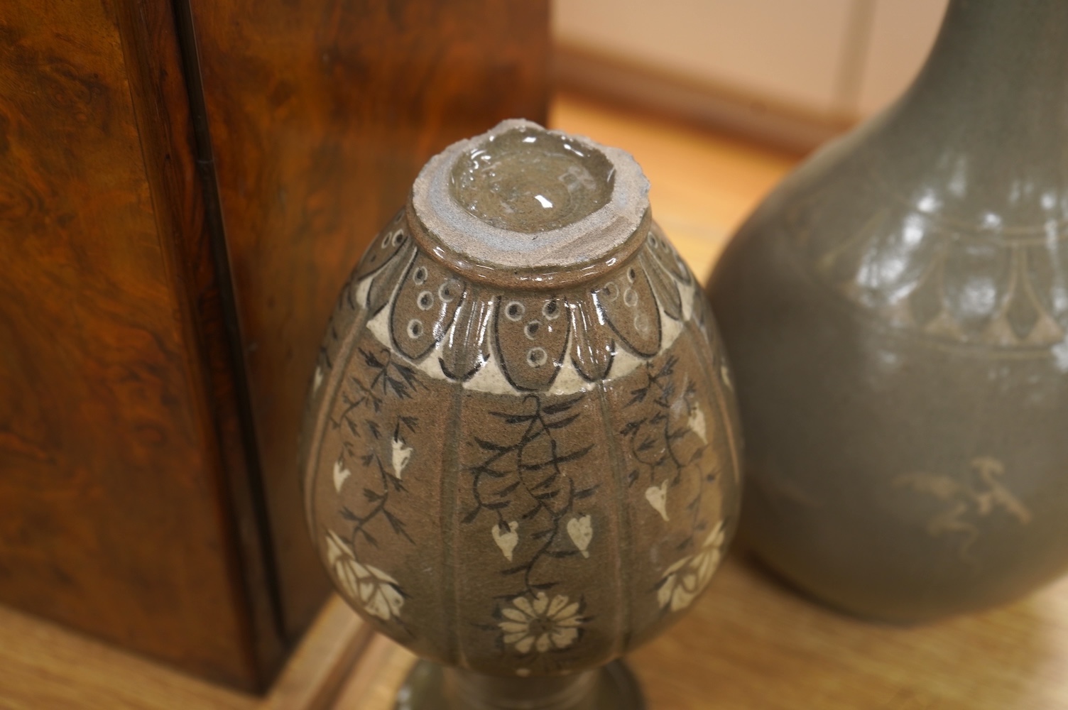 Five pieces of Chinese/Korean celadon comprising three bowls and two vases, 31cm high. Condition - some breaks